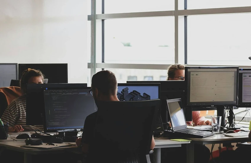 Employees are working on office desktop